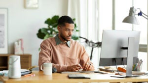 Young businessman is working at home office.