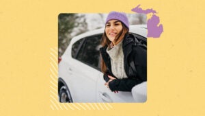 Person hanging out of the passenger side window of car enjoying the breeze