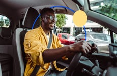 Smiling black man driving