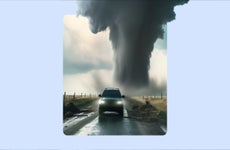 Truck driving away from tornado