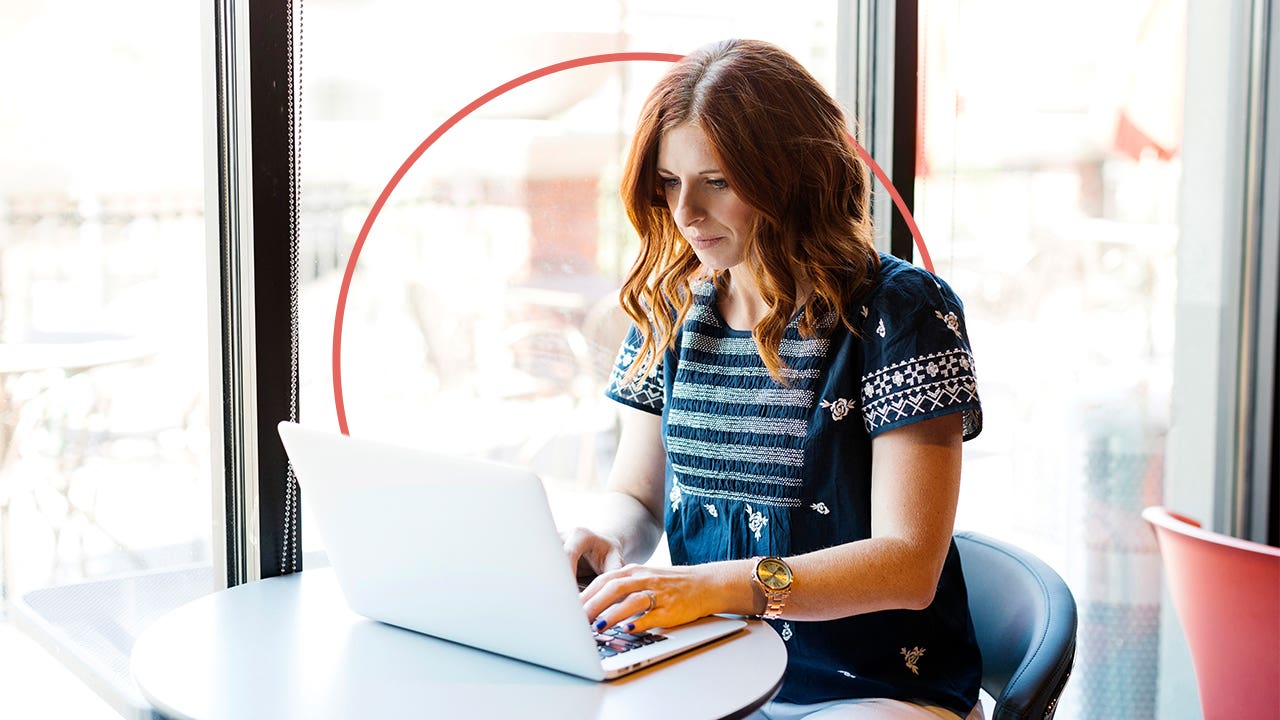 Woman typing on a laptop