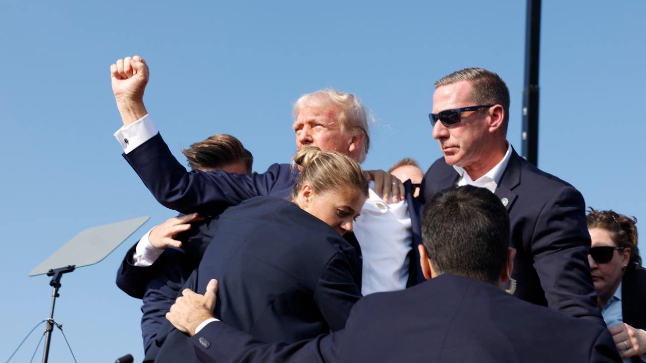 Former President Donald Trump is rushed offstage during a rally on July 13, 2024 in Butler, Pennsylvania.