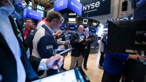 Traders work on the floor of the New York Stock Exchange