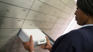 Woman taking safety deposit box out