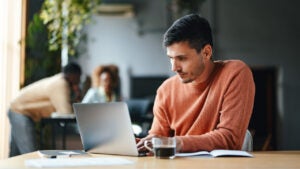 A Focused Businessman Working On His Computer