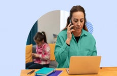 Woman working from home with a child in the background
