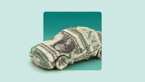 American dollar bill folded into the shape of a sedan. Image is on top of a light green background.