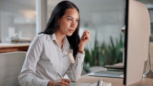 Business, thinking and woman with computer