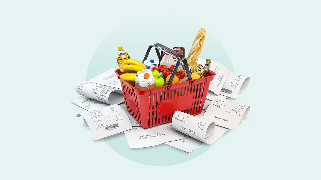 A full grocery basket surrounded by grocery receipts