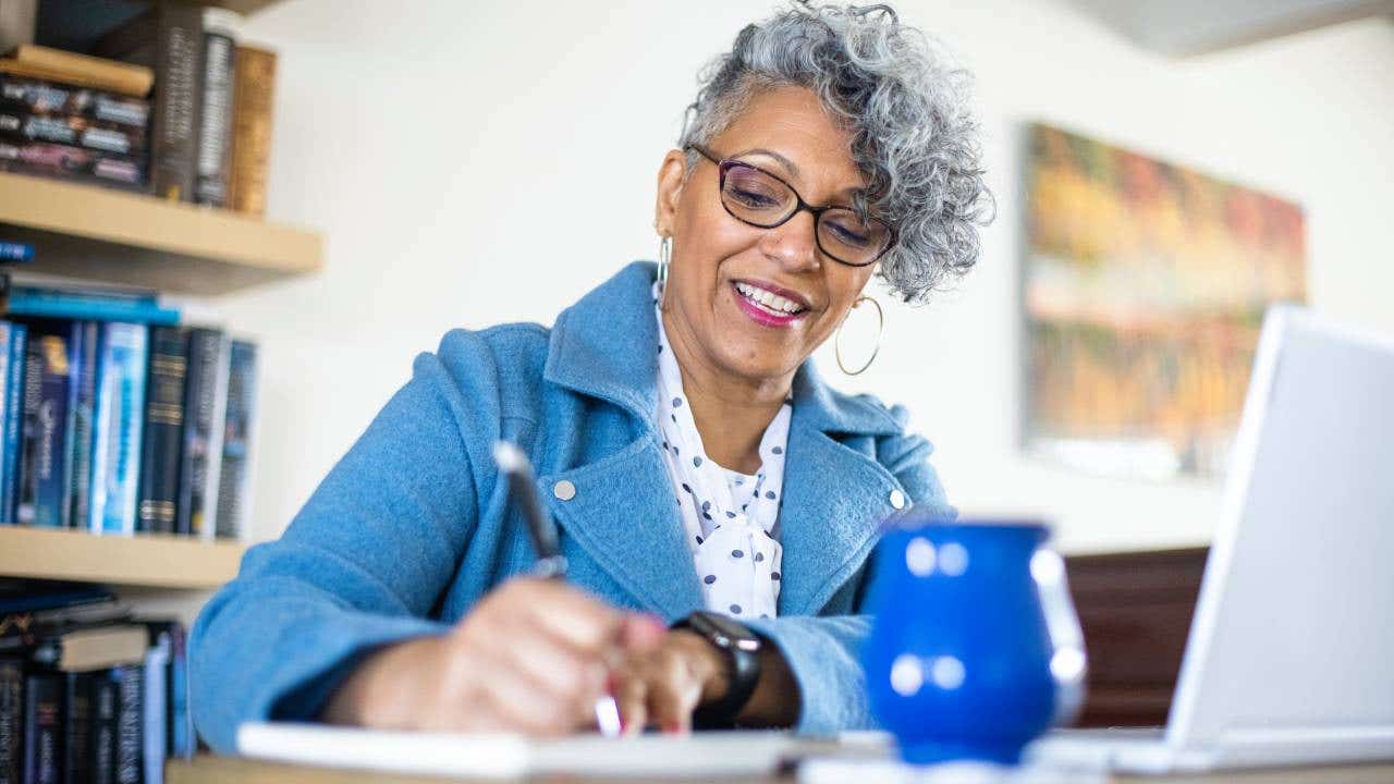 woman with gray hair working from home