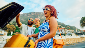 Three happy friends capture a cheerful moment with a selfie during their travel adventure