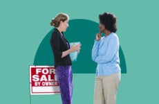 Two women chatting in front of a for sale sign
