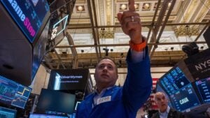 Traders work on the floor of the New York Stock Exchange