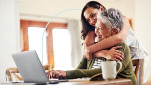 Grandmother and granddaughter hugging