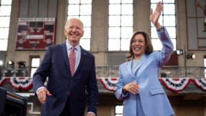 U.S. President Joe Biden and U.S. Vice President Kamala Harris wave to members of the audience.