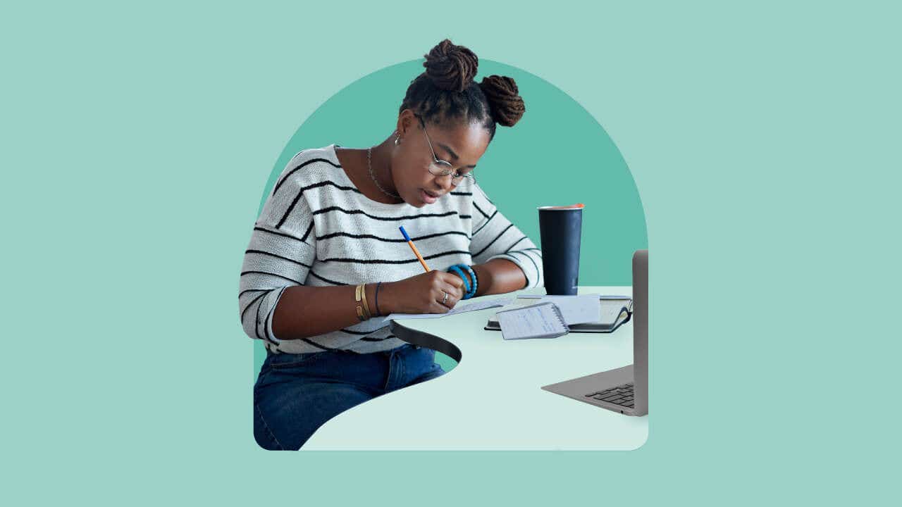 Woman studying at a table with an illustrated light green background