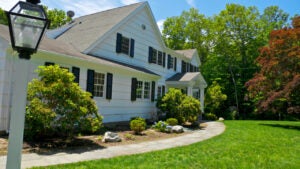 1970's American Colonial style suburban home is seen in Connecticut, New England, USA.