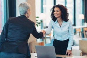 Banker and client shaking hands