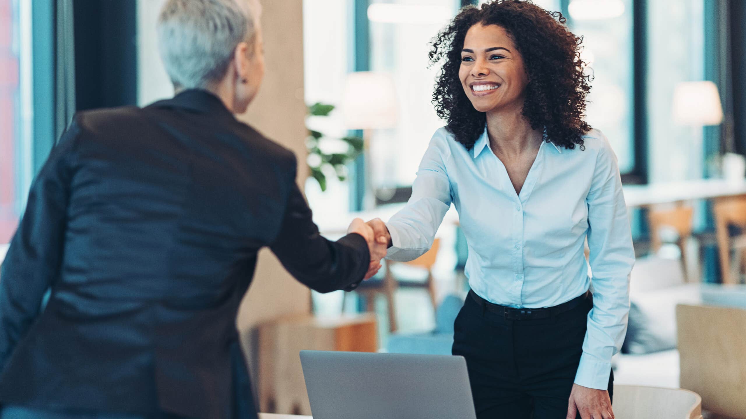 Banker and client shaking hands