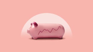 A piggy bank with an upward trending graph on it.