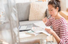 Woman paying bills on laptop