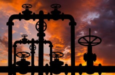 Pipes and valves of the gas pipeline at sunset