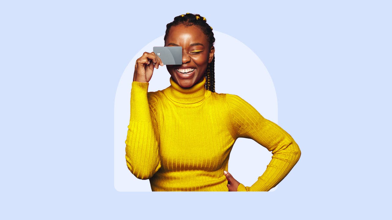 Woman looks at a credit card