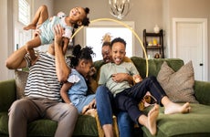 A family sitting together on a couch