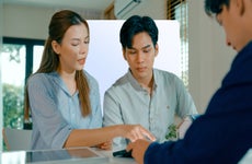 A couple checking out at a counter