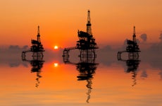 Offshore oil rigs at sunset