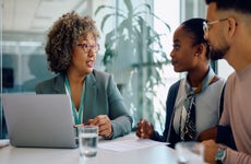 Financial advisor talking to young couple