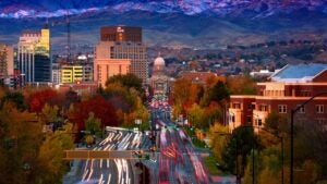 Downtown Boise Idaho at sunset with fresh snow on foothills