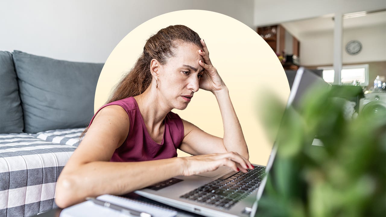 Stressed woman using a computer