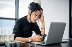 white-collar woman looks tired in the office