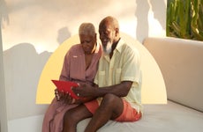 Older couple looking at finances on a tablet