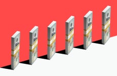 Stacks of money lined up against a colorful red background