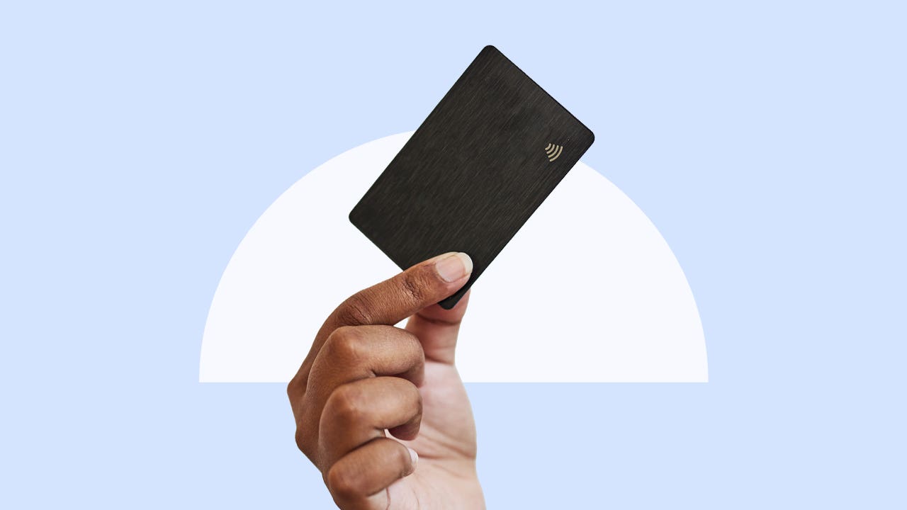 Design element of a hand holding a credit card in the air