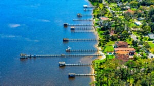 Aerial view of a group of residential boat docks from homes along the Halifax River in Ormond Beach, Florida near Daytona