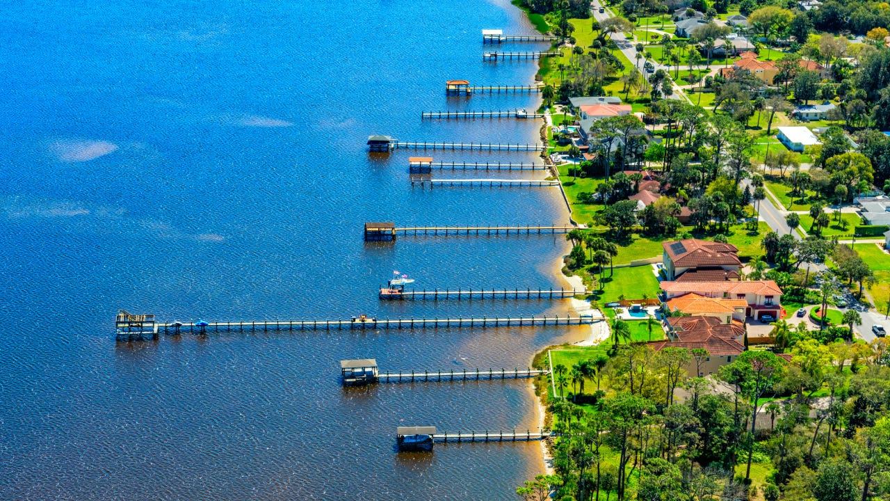 Aerial view of a group of residential boat docks from homes along the Halifax River in Ormond Beach, Florida near Daytona