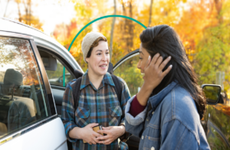 People near car