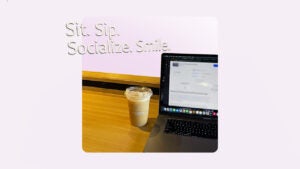 Design element of a coffee sitting next to a laptop.