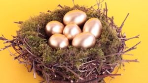 Six golden eggs in a nest.