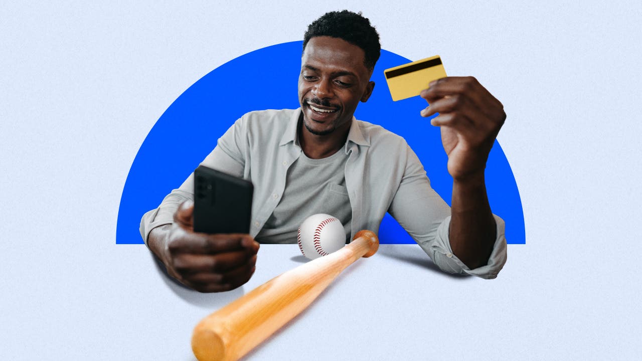 Design element of a man holding a credit card and a cell phone smiling