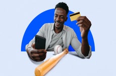 Design element of a man holding a credit card and a cell phone smiling