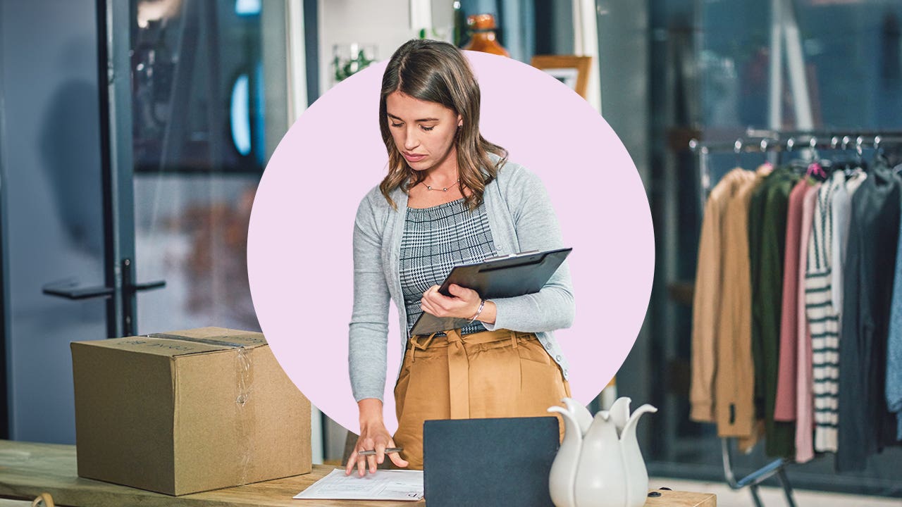 A business person holding a tablet.