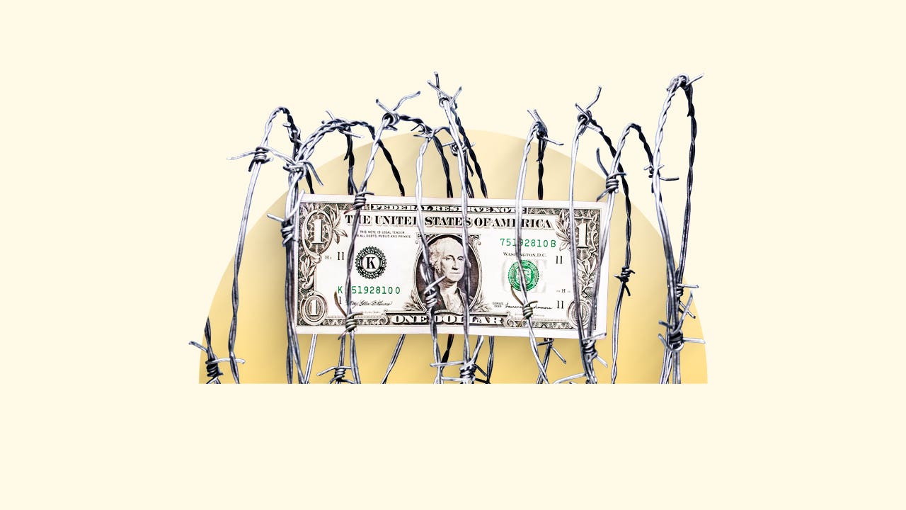 A dollar bill wrapped in barbed wire