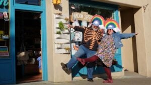 Rosalie and Douglas Gale standing in front of the Ugly Baby shop