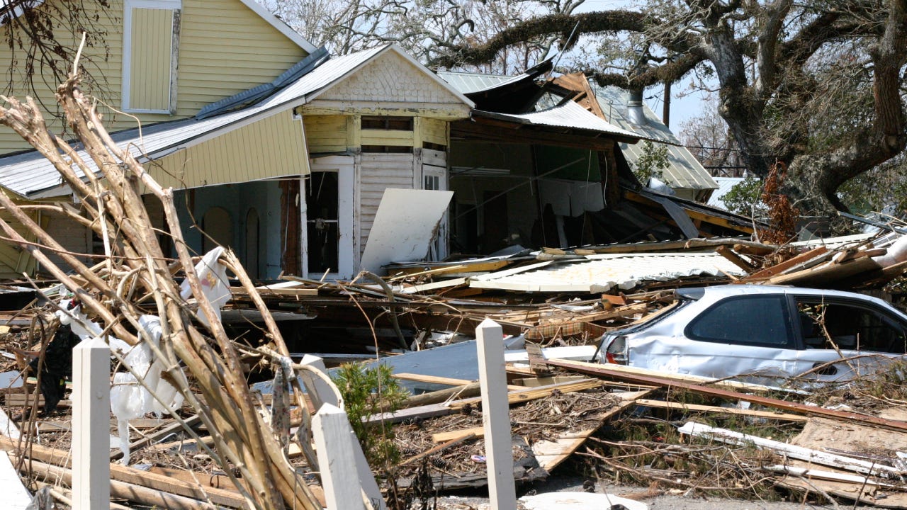 home with surrounding hurricane damage