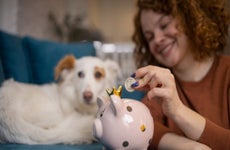 Woman saving money in a piggy bank