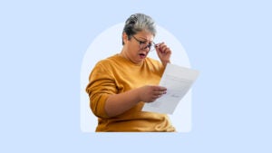 A woman looking at a sheet of paper